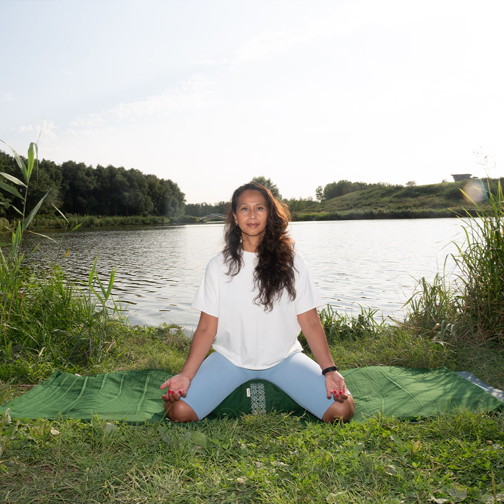Cotton mat - forest green_8 a female meditating on the cotton yoga mat