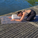 a female exercising yin yoga on the cork mat using yoga bolster 2 Cosmic Harmony Cork Yoga Mat cork yoga mat